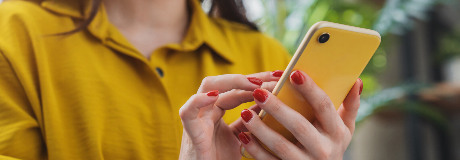 Close up of a woman's hands holding a smartphone