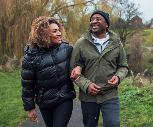 Two adults walking on a path